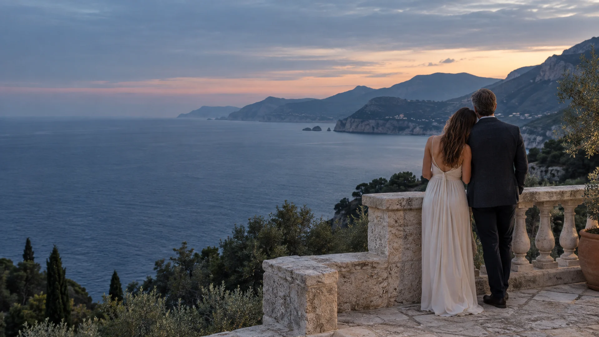 Couple seen from behind enjoying a coastal terrace, illustrating time together on SugarDaddyMeet